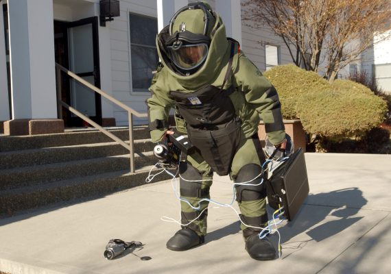 FAIRCHILD AIR FORCE BASE, Wash. (AFPN) -- Senior Airman Sarah Martinez prepares to enter a building where a simulated suspect device was found during an exercise here March 9.  Airman Martinez is an explosive ordinance disposal technician with the base's 92nd Civil Engineer Squadron.  (U.S. Air Force photo by Staff Sgt. Laura K. Smith)